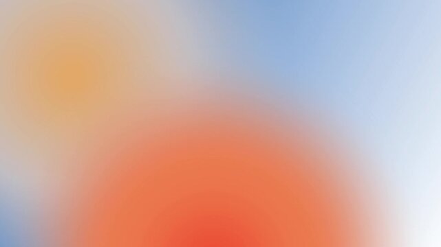 Soft blurred circles of orange and blue light blend together in a warm abstract composition creating a dreamlike bokeh background with a sense of optimism