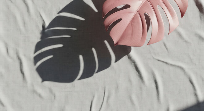 minimalist top view of a pink monstera leaf resting on a wrinkled light gray fabric, casting a sharp artistic shadow under bright sunlight for a modern botanical and aesthetic lifestyle design.