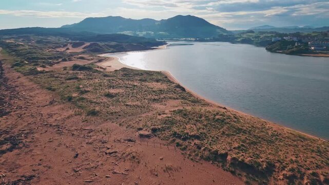 Aerial view of Liencres beach and Costa Quebrada rugged coastline in Cantabria, Spain