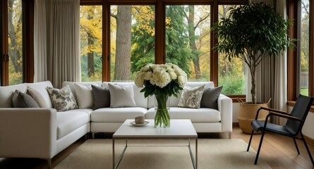 Fototapeta premium Cozy modern living room interior with white sofa and autumn forest view