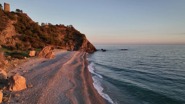 Cinematic Drone Orbit Over Secluded Sunset Beaches and Rocky Cliffs Near Nerja, Andalusia, Spain