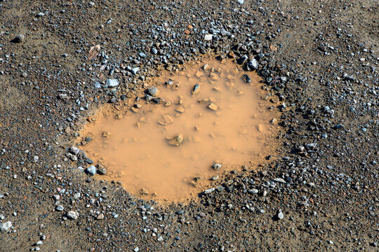 Closeup Of A Muddy Pothole
