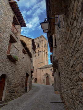 Ainsa medieval village street leading to romanesque church