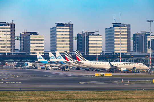 New York, USA - 22.01.2026: Air France and KLM airplanes parked at the gates of Schiphol Airport terminal with modern office buildings