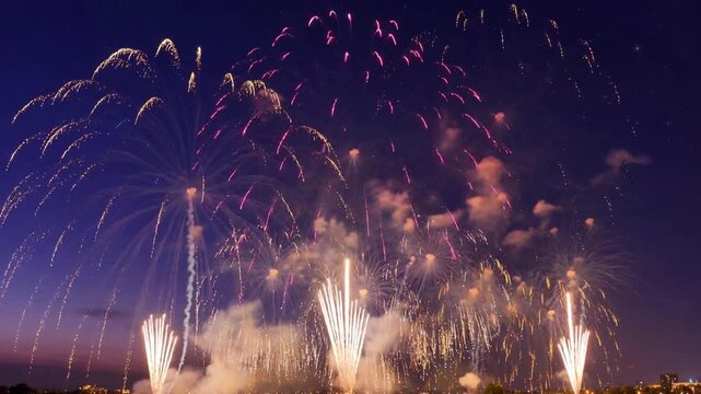 Grand colorful fireworks display over city at night, festive celebration finale