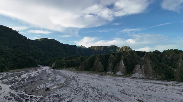 Aerial 4K View of 4x4 Off-Road Convoy driving past the Toblerone Hills towards the Mount Pinatubo Crater Jump-off, Philippines