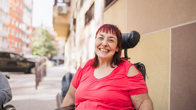 Woman with a disability finding joy and independence, actively participating in urban life from her wheelchair