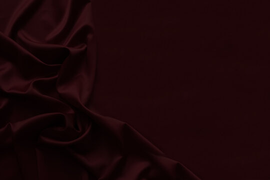 Black dark burgundy red silk fabric with elegant drapery folds, luxury satin textile background, rich crimson velvet style abstract backdrop. Festive. Empty template design ad.Top view table, flat lay