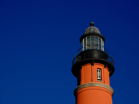 A gorgeous blue sky brings out the beautiful brickwork of the Ponce Inlet Lighthouse south of Daytona Beach Florida