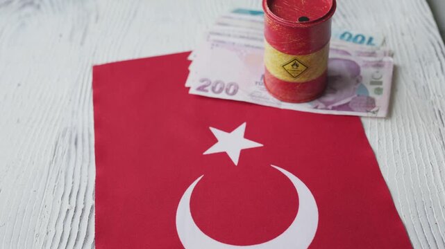 Miniature oil drum and Turkish Lira banknotes on Turkey flag