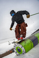 Skier Sliding Rail Feature in Terrain Park © Henry