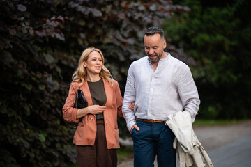 Fototapeta premium Mature couple walking and talking in nature