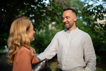 Fototapeta premium Happy couple enjoying outdoor conversation in park