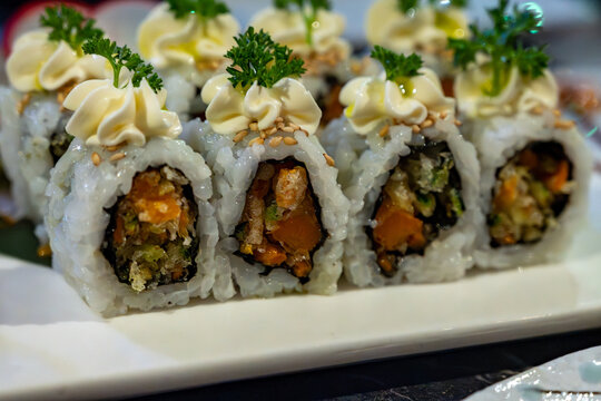 Perfect decorated Japanese sushi rolls with crunchy fried tempura vegetables, vegetarian sushi, vasabi and mayonnaise