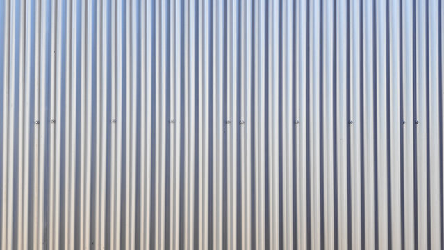 Corrugated metal sheet wall as background pattern