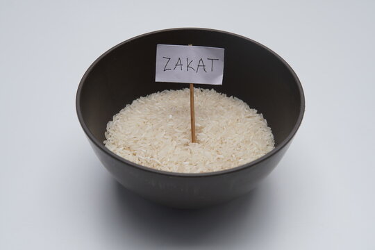 visualizing the concept of zakat through a simple yet powerful bowl of rice. perfect for illustrating themes of ramadhan and idul fitr