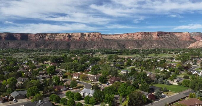 Aerial of Colorado National Monument with Redlands neighborhood in Grand Junction in spring