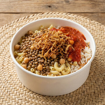 Traditional Egyptian Koshary Bowl with Rice Lentils Pasta Chickpeas and Tomato Sauce Top View
