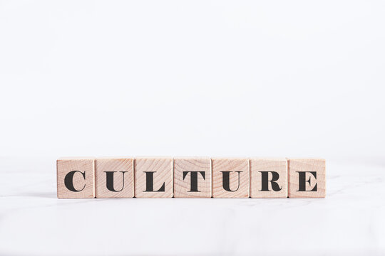 CULTURE Word on Wooden Blocks Isolated on White, concept for corporate identity, social diversity, and organizational values.