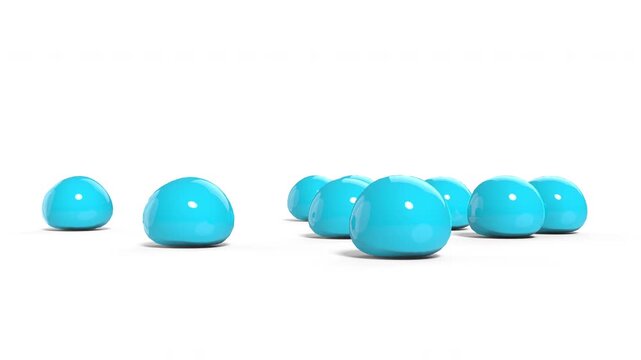 Blue soft elastic balls dropping from above and falling and bouncing on the ground