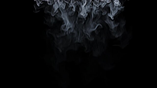 Thin gray smoke falling slowly from the top of the frame