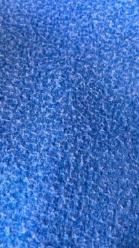 Macro shot of blue soft fiber textile texture background