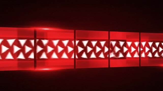 Abstract red geometric motion graphics animation featuring glowing triangular patterns and futuristic light effects.