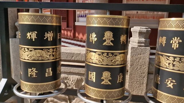Buddhist Prayer Wheels in Front of Temple of Six Banyan Trees in Guangzhou, China