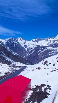 Red Shed At Andes Mountains Santiago Chile. Skier Skiing Downhill On Empty Ski Slopes In The Mountains. Snowflakes Tourism Andes Mountains Map Blizzard. Andes Mountains Map Lagoon Outdoor.