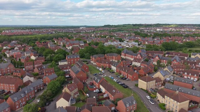 Aerial drone footage of Oakhurst in Swindon, Wiltshire, showcasing modern residential housing, streets, and suburban development