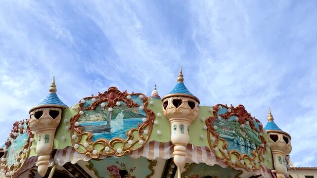 Vintage Carousel Top Spinning Against a Bright Blue Sky in Cassis France