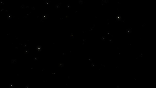 Golden sparkling dust particles floating slowly on black background creates abstract magical celebration overlay