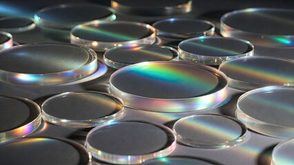 Obraz premium Exploring colorful light refraction in smooth lens discs close-up creative studio photography