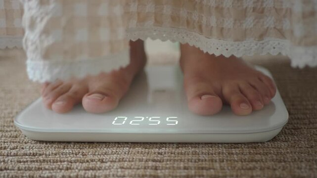 Weight measurement on scale with bare feet in a home