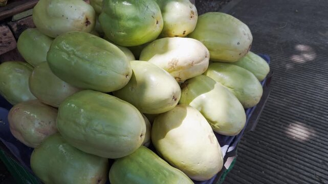 Close-up of pile of fresh sweet granadillas, type of passion fruit, for sale at local market