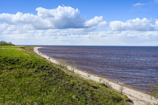 The elongated Ilmensky Glint beach on the shore of Lake Ilmen, Novgorod region of Russia