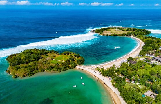 Aerial View of Luxury Resort Area and Pristine White Sand Beach in Nusa Dua, Bali.