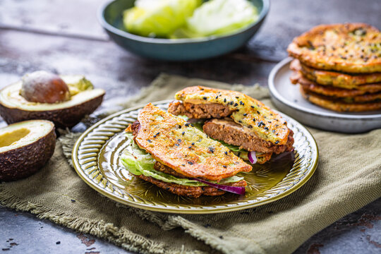 Gluten free  burger with avocado flat bread, with vegetables and cream cheese