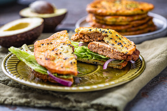 Gluten free  burger with avocado flat bread, with vegetables and cream cheese
