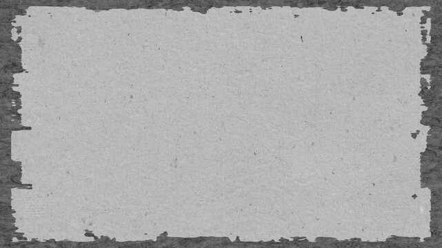 Textured gray background with dark frame featuring rough edges suitable for various creative projects