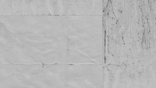 Textured grey grunge surface with scratches and marks ideal for backgrounds and abstract design elements