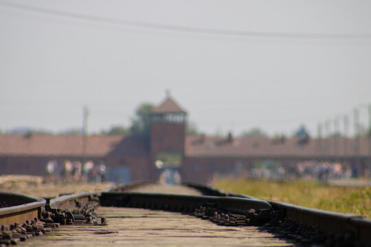 Auschwitz-Birkenau concentration camp view of the train rails with the main entrance defocused on the back on May 30, 2026 in Oświęcim, Poland.	