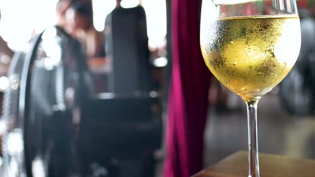 Chilled Glass of White Wine on Outdoor Restaurant Patio Table