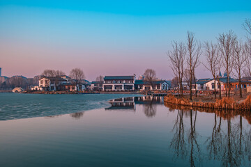 Fototapeta premium Hailong Lake Scenic Area in Meihekou – Ecological Wetland and Urban Park Landscape with Lakeside Recreation, Commercial Street and Public Leisure Spaces, China – April 2, 2026