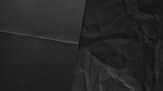 Black Crumpled Paper Texture with Creases background