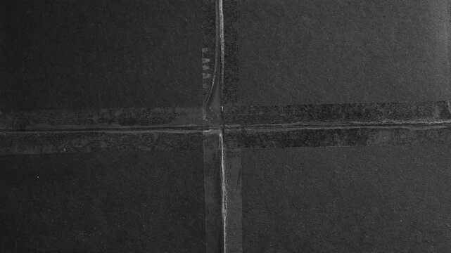 Black Paper Folded and Taped with Transparent Tape