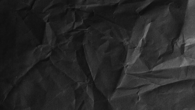 Crumpled Black Paper Texture with Deep Shadows abstract