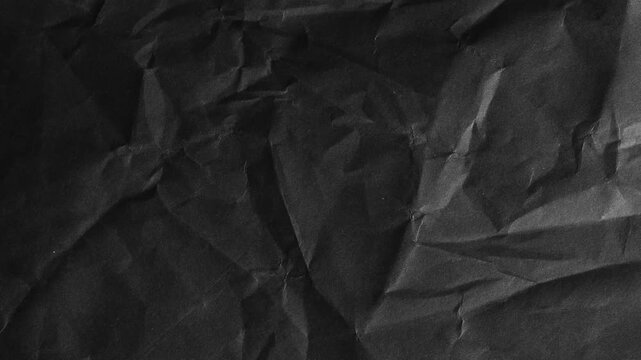 Crumpled Black Paper Texture with Deep Shadows background