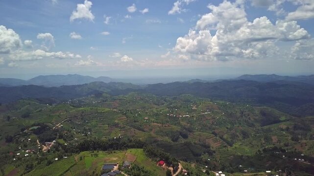 Kigezi Highlands in Kanungu District Uganda show smallholder mosaic agriculture with banana groves maize fields and mixed cropping linked to dispersed homesteads and subsistence system, drone descent