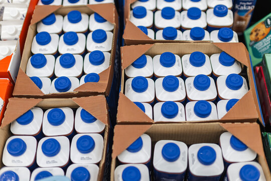 Milk cartons packed in cardboard boxes for supermarket retail distribution